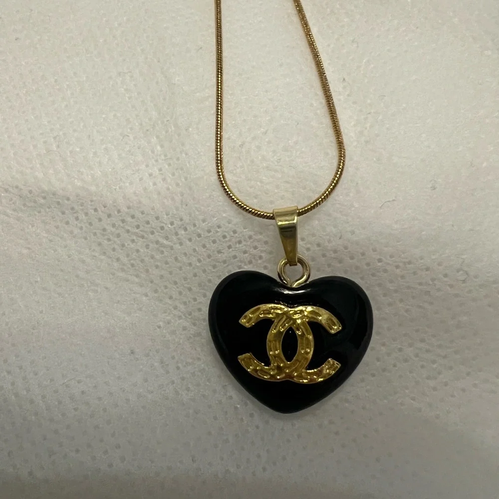 CHANEL Black Heart Pendant Necklace with Gold CC Emblem